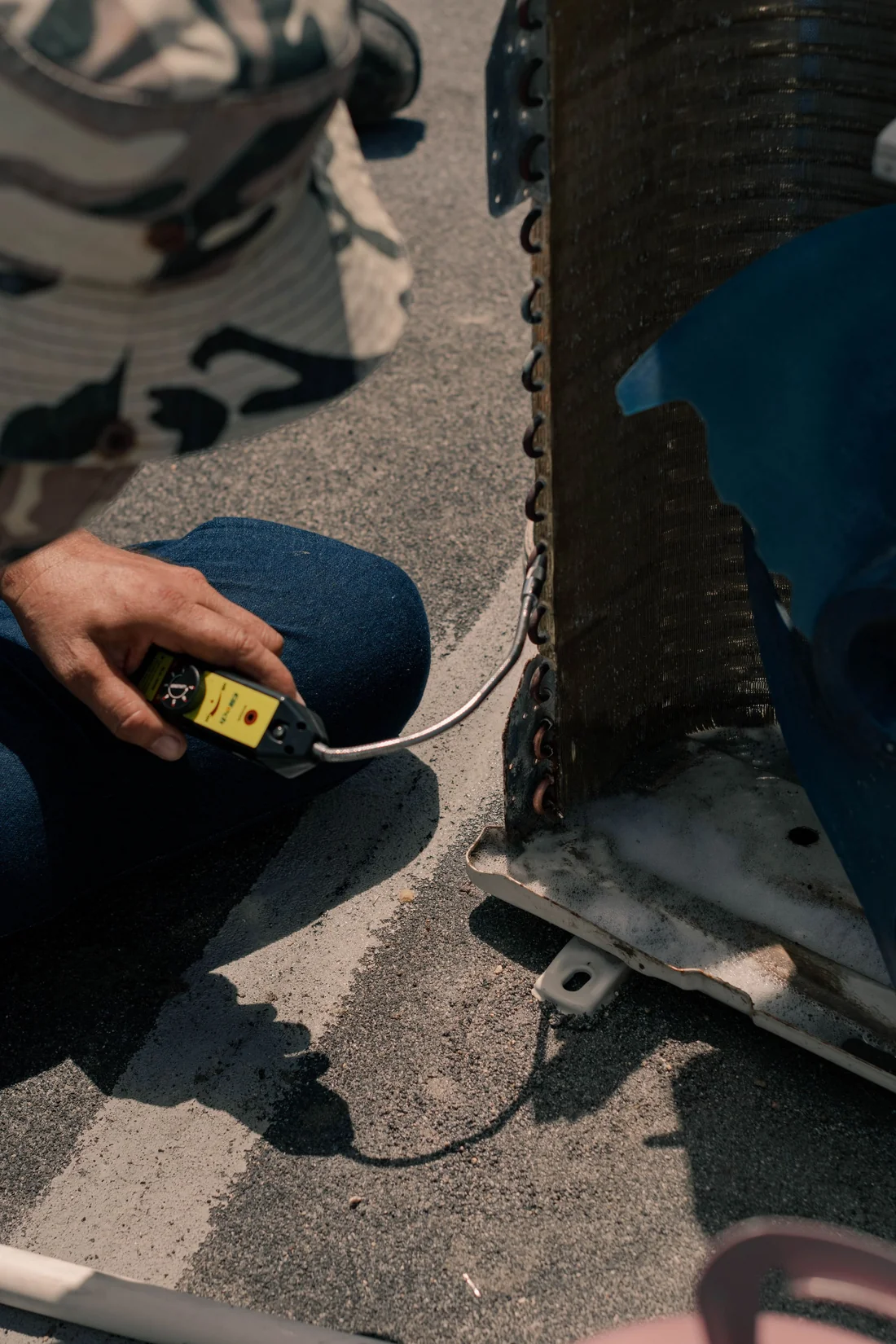 Technician testing heating and cooling equipment