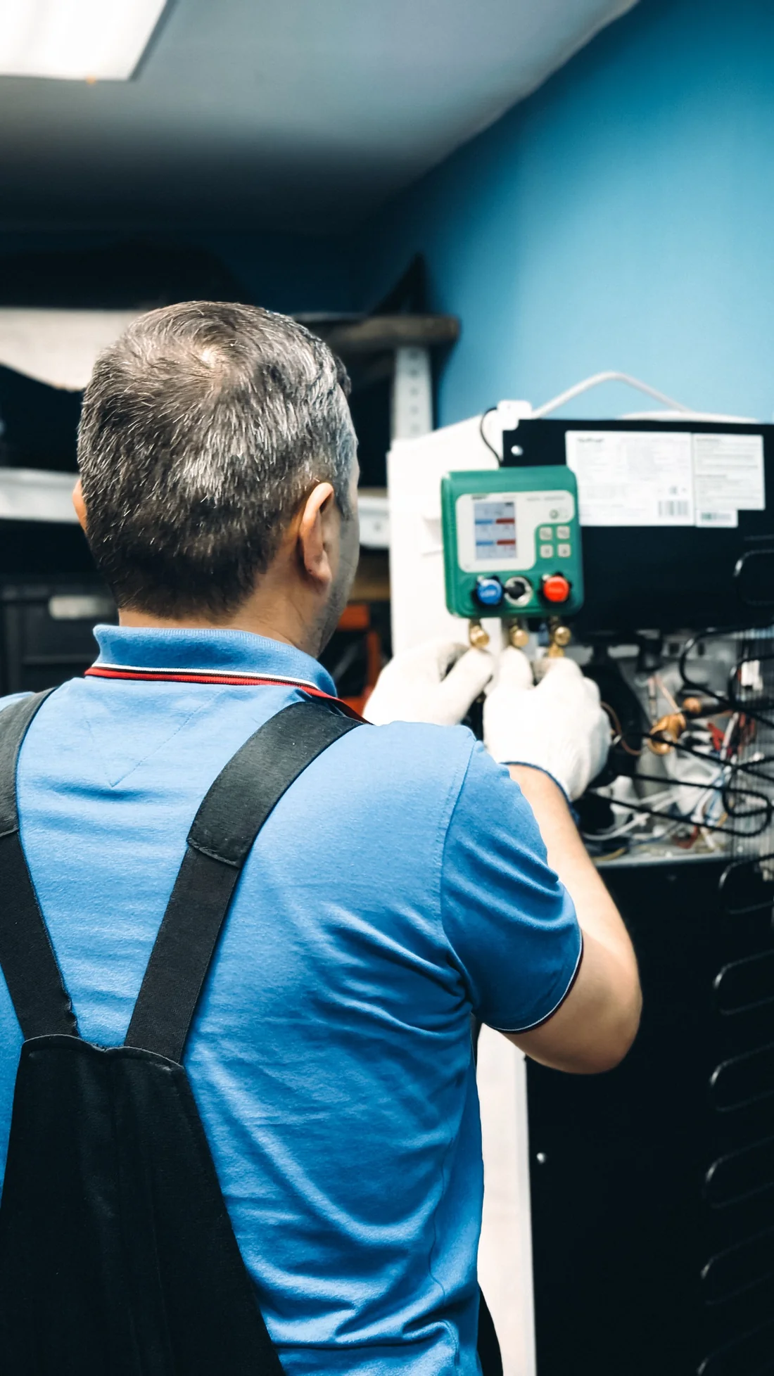 Technician performing a seasonal heating system inspection