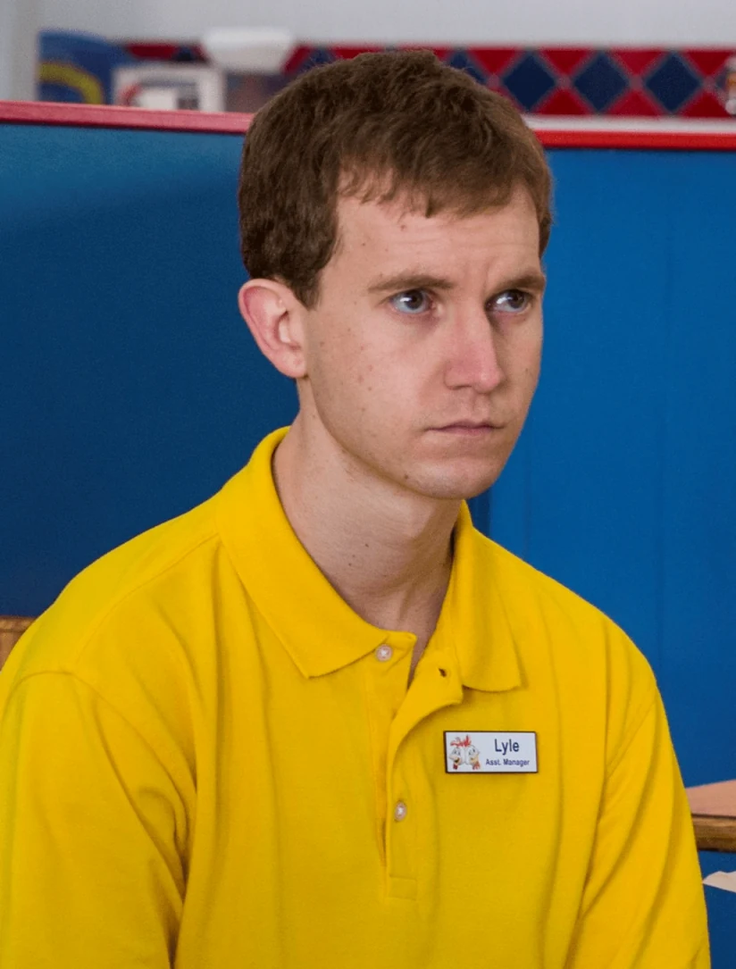 Lyle behind the counter in his Los Pollos Hermanos uniform