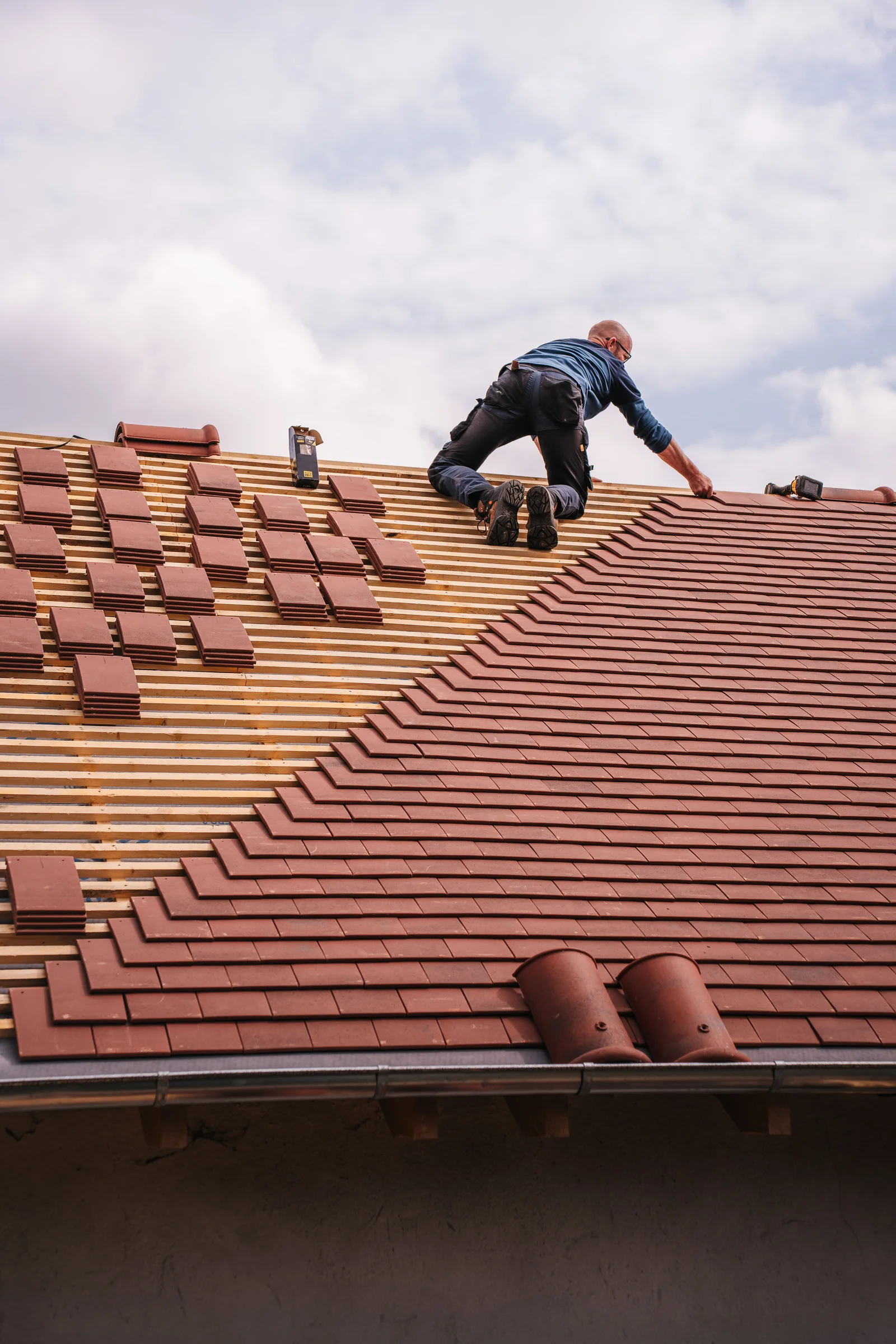 Roofing professional working on a roof installation